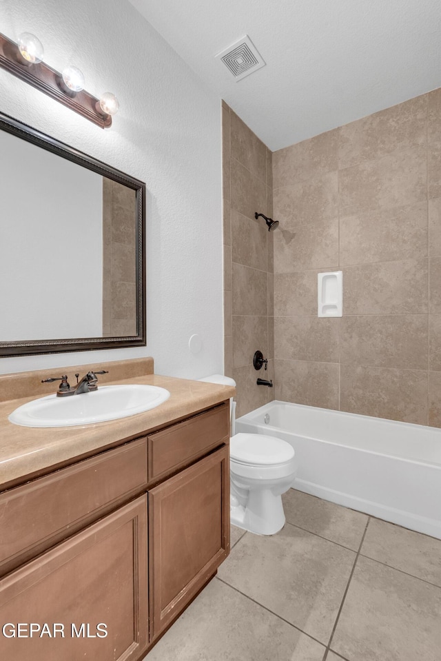 full bathroom with visible vents, toilet, bathing tub / shower combination, tile patterned floors, and vanity