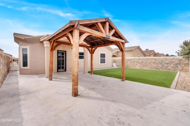 view of patio featuring a gazebo and a fenced backyard