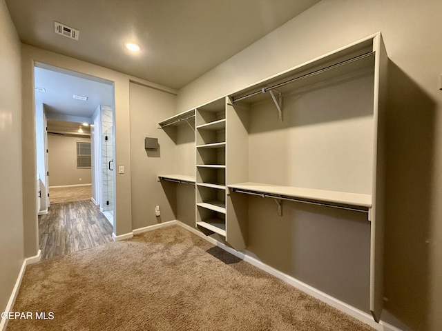 walk in closet with carpet flooring and visible vents