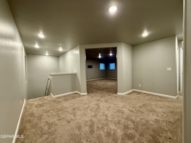 basement with baseboards and carpet floors