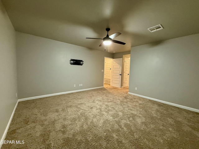 unfurnished bedroom with visible vents, baseboards, carpet floors, and ceiling fan