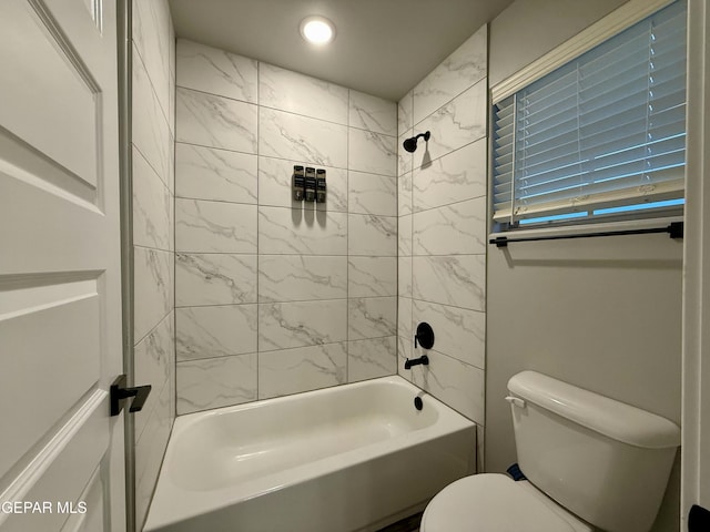 bathroom featuring recessed lighting, toilet, and shower / bathtub combination