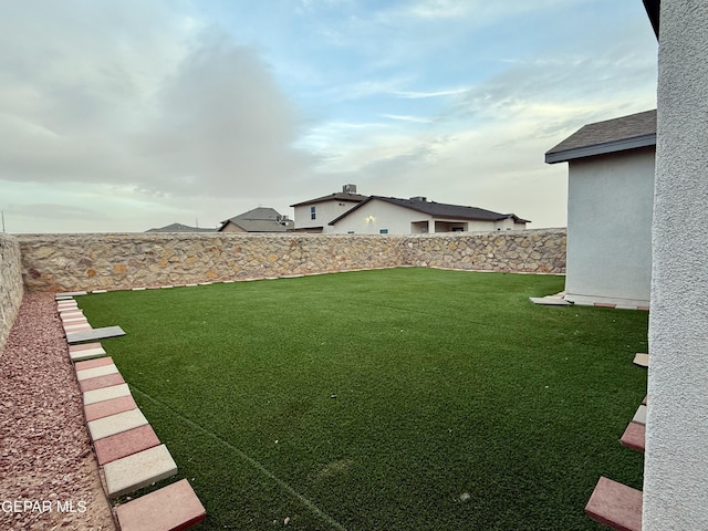 view of yard featuring a fenced backyard