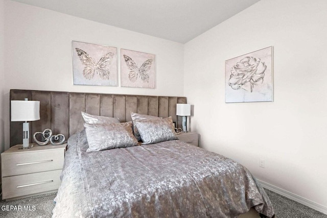 carpeted bedroom featuring baseboards