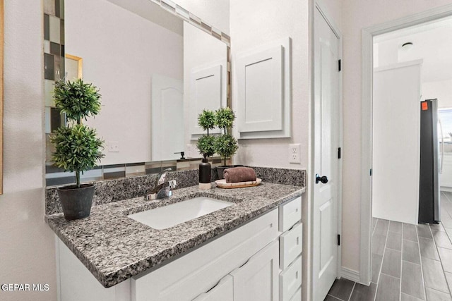 bathroom with wood tiled floor and vanity