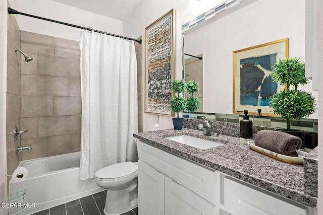 bathroom featuring shower / bathtub combination with curtain, toilet, and vanity