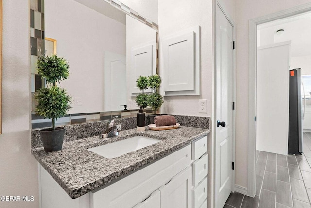 bathroom with vanity and wood tiled floor