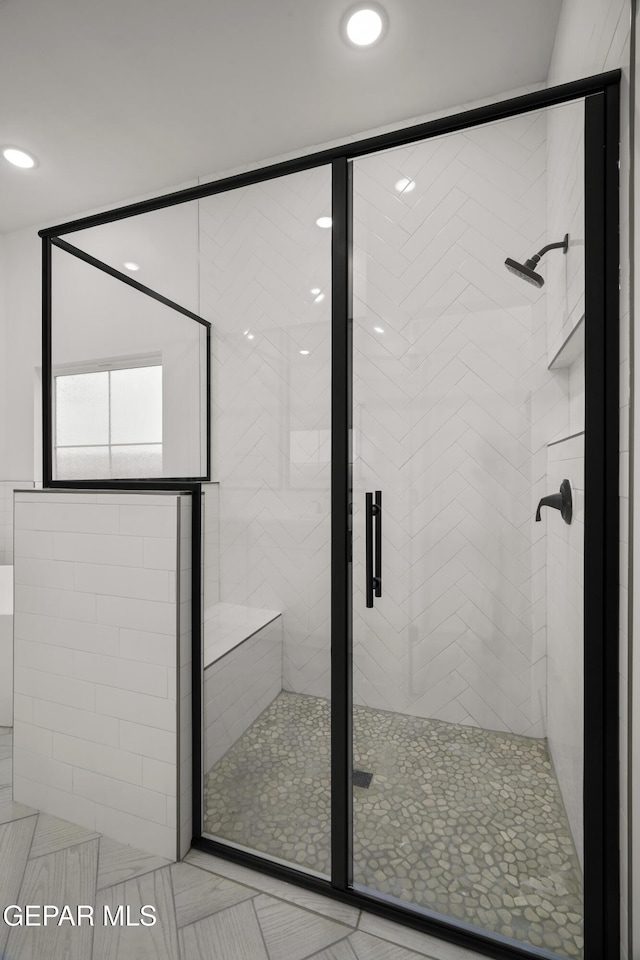 bathroom featuring a shower stall and recessed lighting