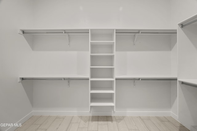 spacious closet featuring wood tiled floor