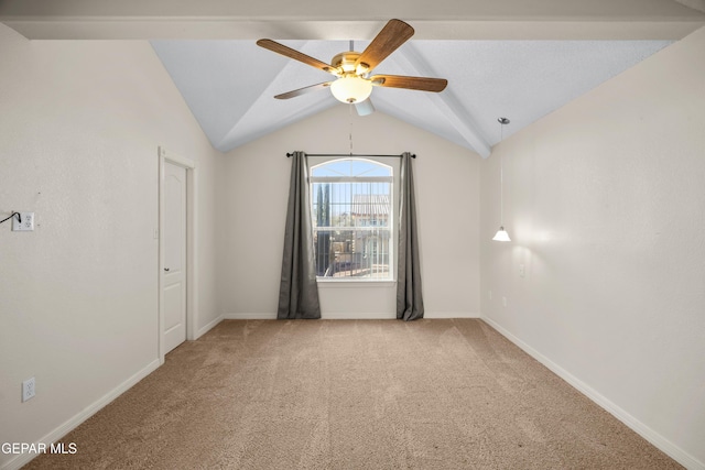 spare room with baseboards, carpet, lofted ceiling, and ceiling fan