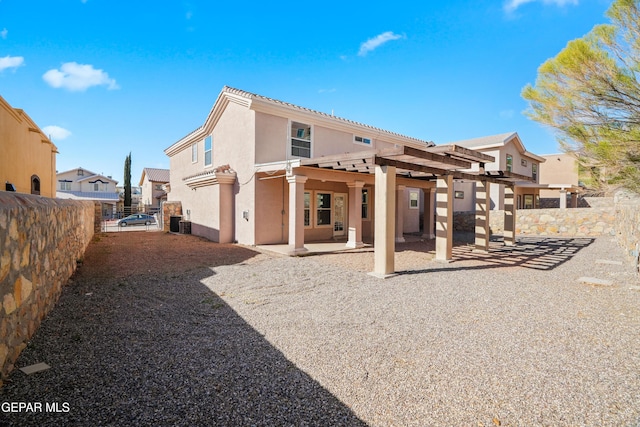 back of house with a patio, cooling unit, a fenced backyard, a pergola, and stucco siding