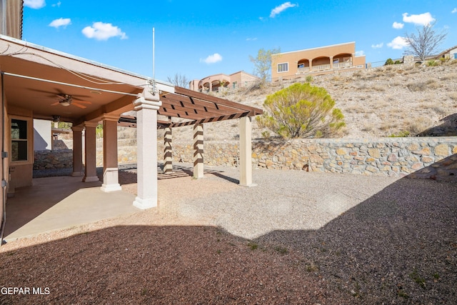 view of patio featuring a pergola and a ceiling fan