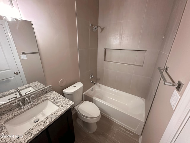 full bath featuring toilet, shower / washtub combination, and vanity