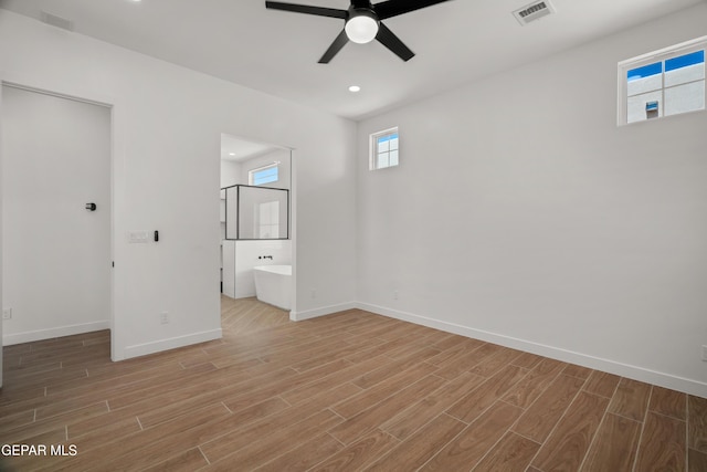 unfurnished bedroom with light wood finished floors, visible vents, recessed lighting, and baseboards