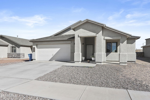 ranch-style home featuring stucco siding, an attached garage, and driveway