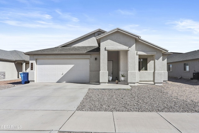 view of front of property with concrete driveway, an attached garage, cooling unit, and stucco siding