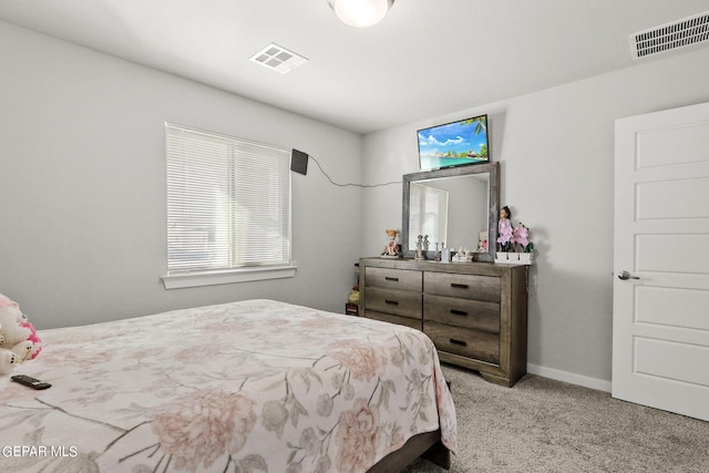 bedroom with visible vents, baseboards, and carpet floors