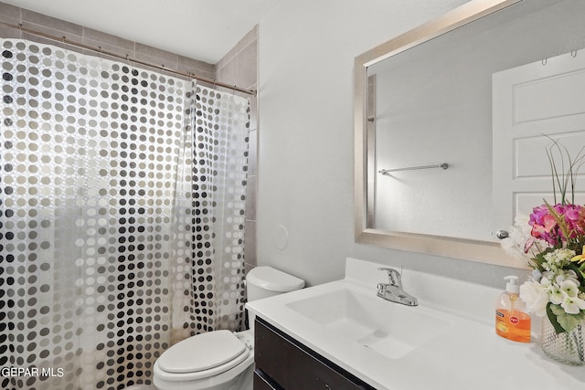 full bath with vanity, a shower with shower curtain, and toilet