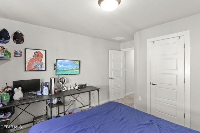 carpeted bedroom featuring baseboards