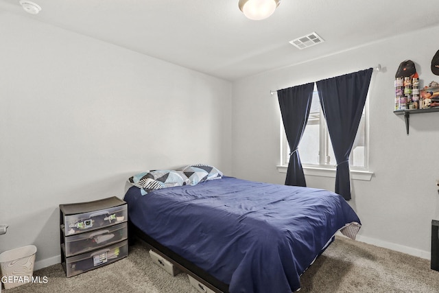 bedroom featuring visible vents, baseboards, and carpet floors