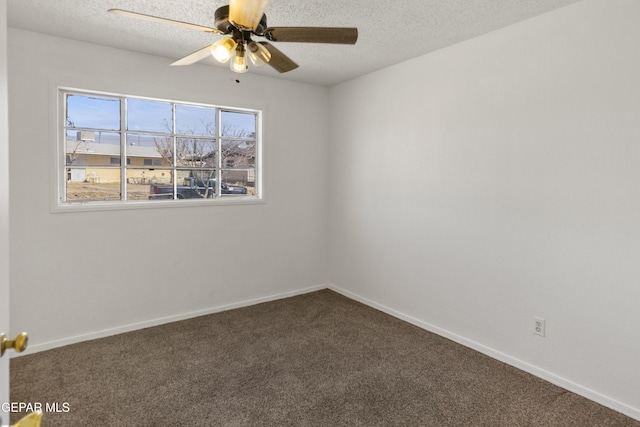 carpeted empty room featuring baseboards, a textured ceiling, and ceiling fan