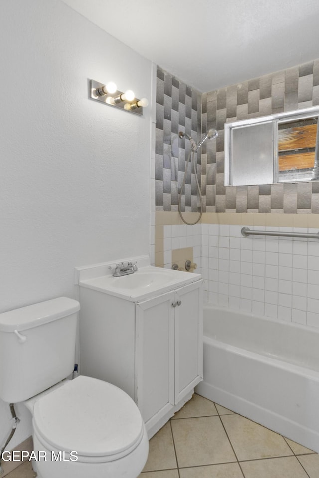 bathroom featuring tile patterned flooring, shower / bathing tub combination, toilet, and vanity