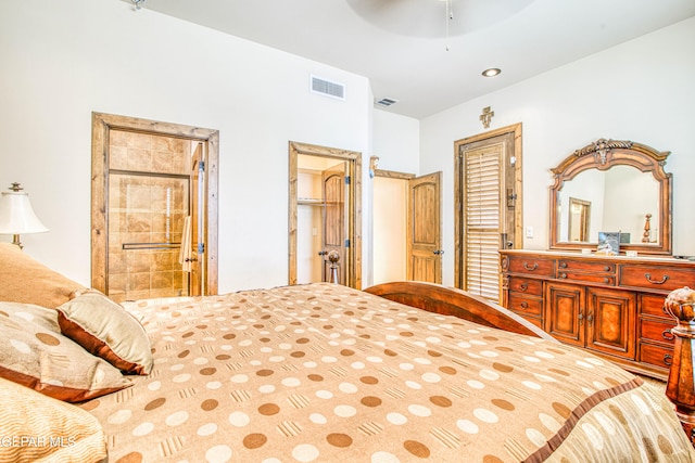 bedroom with visible vents, connected bathroom, and ceiling fan