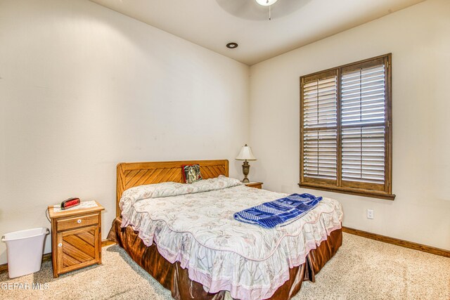 bedroom featuring carpet flooring, a ceiling fan, and baseboards