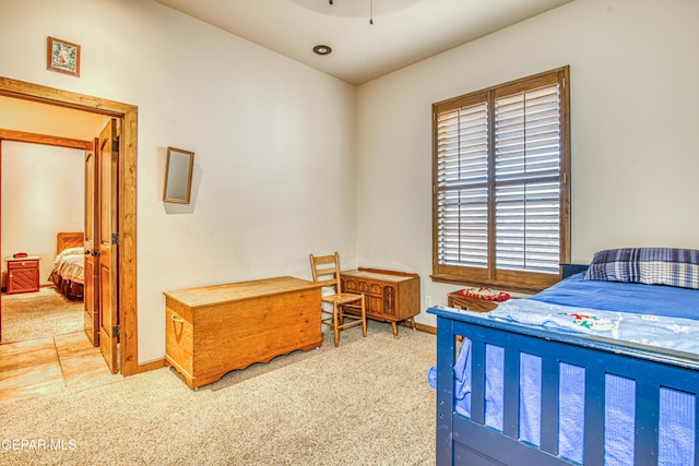 carpeted bedroom with baseboards