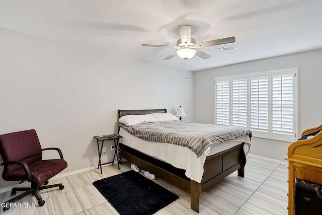 bedroom featuring a ceiling fan, visible vents, and baseboards