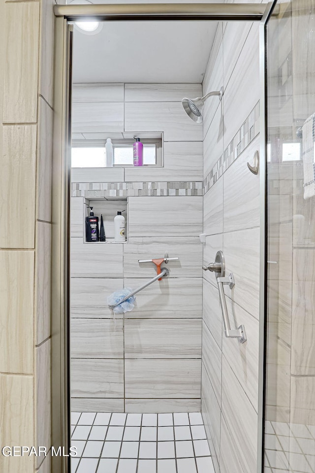 full bathroom featuring a shower stall