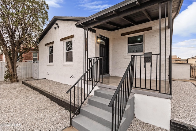 doorway to property with fence