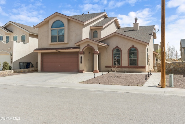 view of front of property featuring stucco siding, a garage, concrete driveway, and a shingled roof