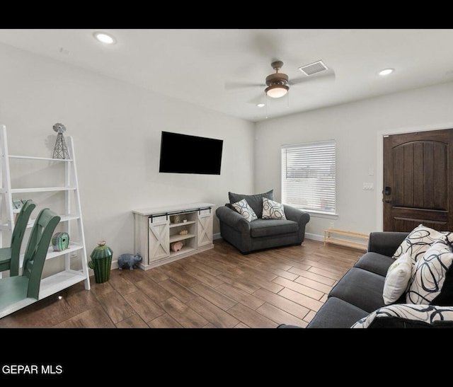 living room featuring visible vents, a ceiling fan, wood finished floors, recessed lighting, and baseboards