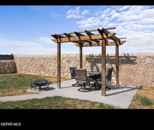 view of patio with a pergola and fence