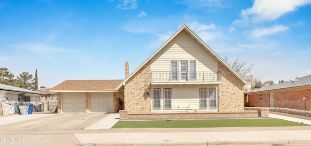 view of front of property with brick siding, concrete driveway, and an attached garage