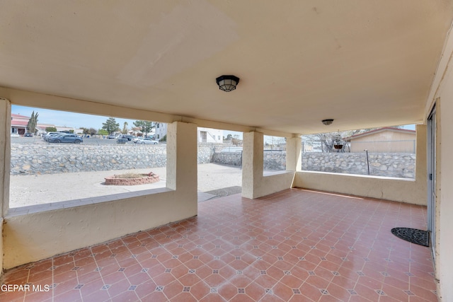 view of patio / terrace featuring fence
