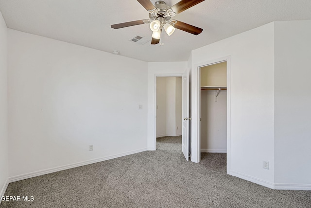 unfurnished bedroom featuring visible vents, a ceiling fan, a closet, carpet floors, and baseboards