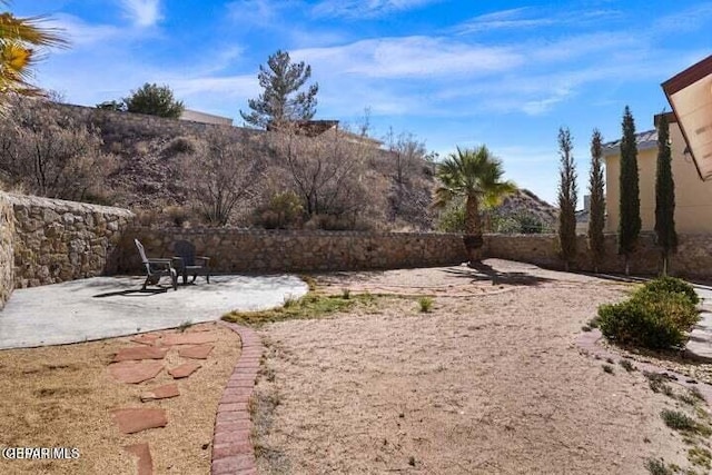 view of yard featuring a patio and fence