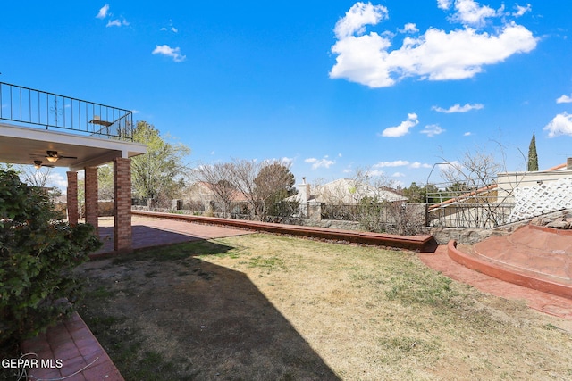 view of yard featuring a balcony and a patio area