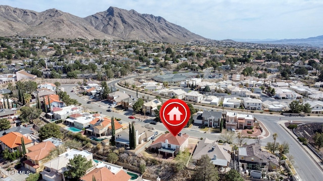 drone / aerial view featuring a residential view and a mountain view