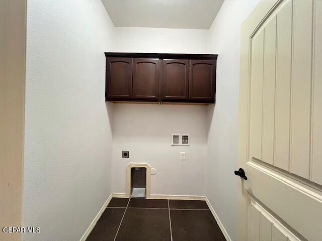 laundry area with washer hookup, dark tile patterned flooring, baseboards, and hookup for an electric dryer