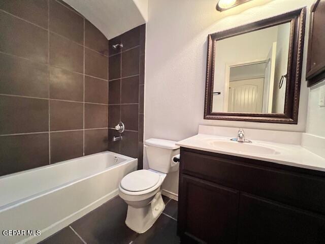 full bath featuring vanity, tile patterned floors, toilet, and shower / bathtub combination