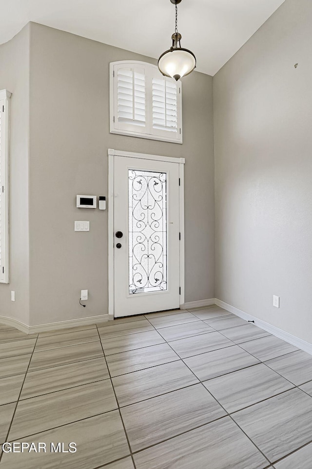 entrance foyer featuring baseboards