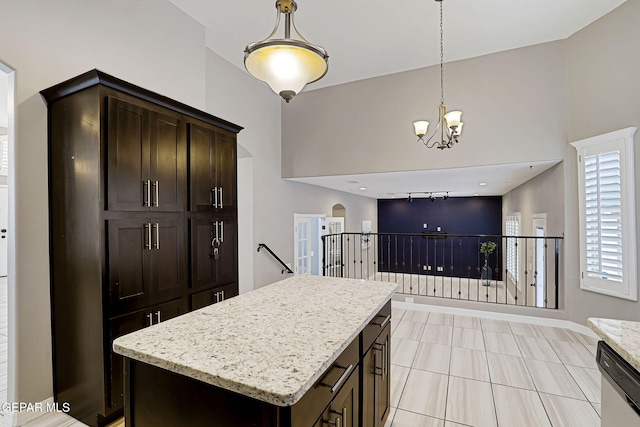 kitchen featuring pendant lighting, a notable chandelier, dishwasher, and dark brown cabinets