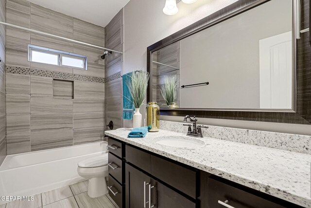 bathroom featuring shower / washtub combination, toilet, and vanity