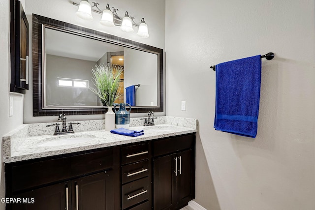 bathroom with double vanity and a sink