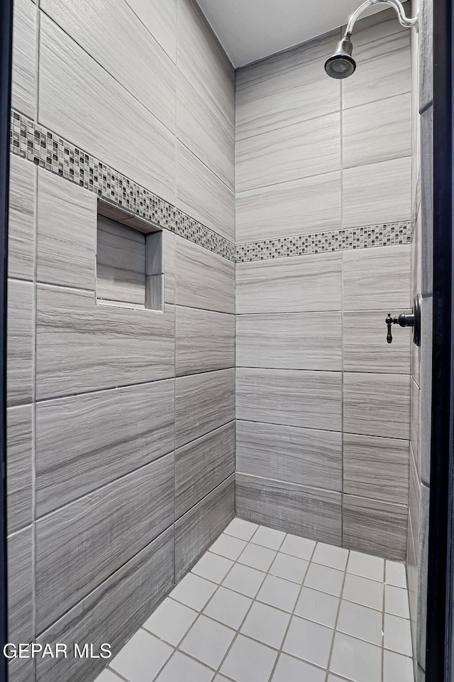 bathroom with a tile shower