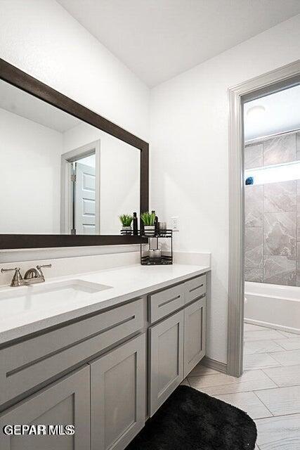 full bathroom with vanity and bathing tub / shower combination