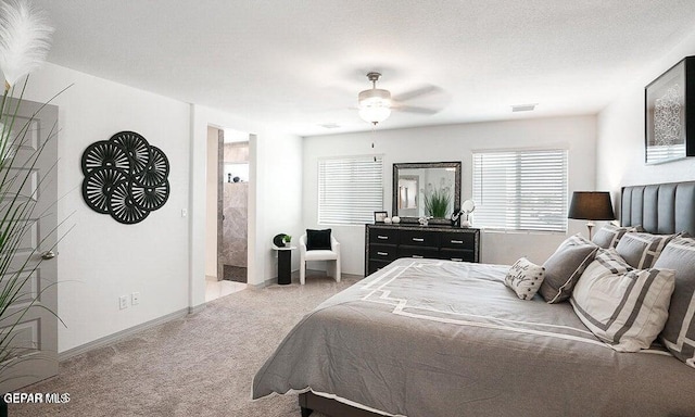 carpeted bedroom with visible vents, a textured ceiling, baseboards, and a ceiling fan